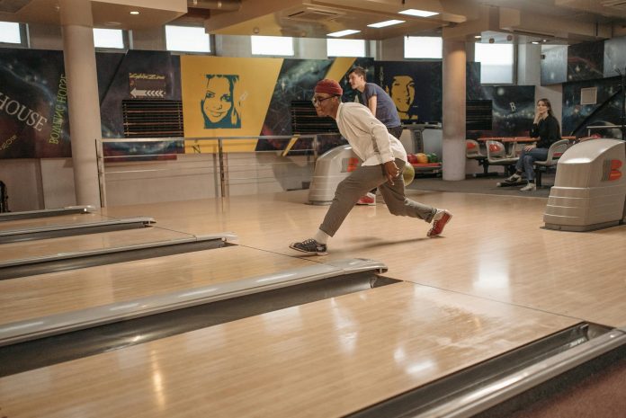 Friends Playing Bowling for Recreation