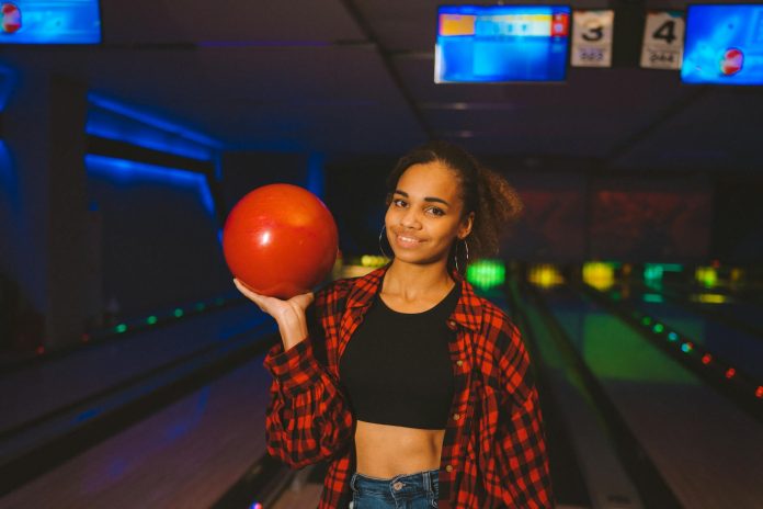 A Woman Holding a Bowling Ball