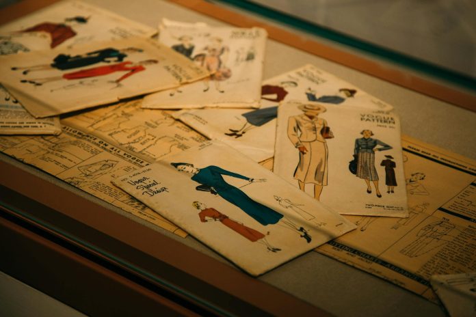 Images of old style dresses on table