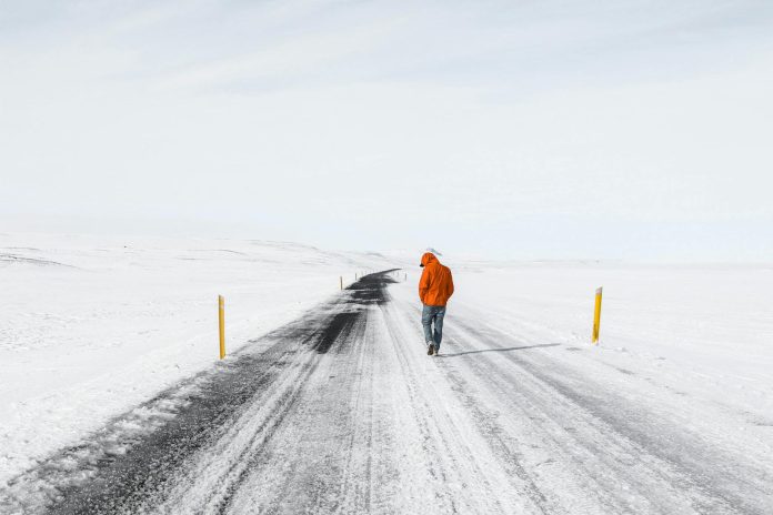 Person Standing on Highway